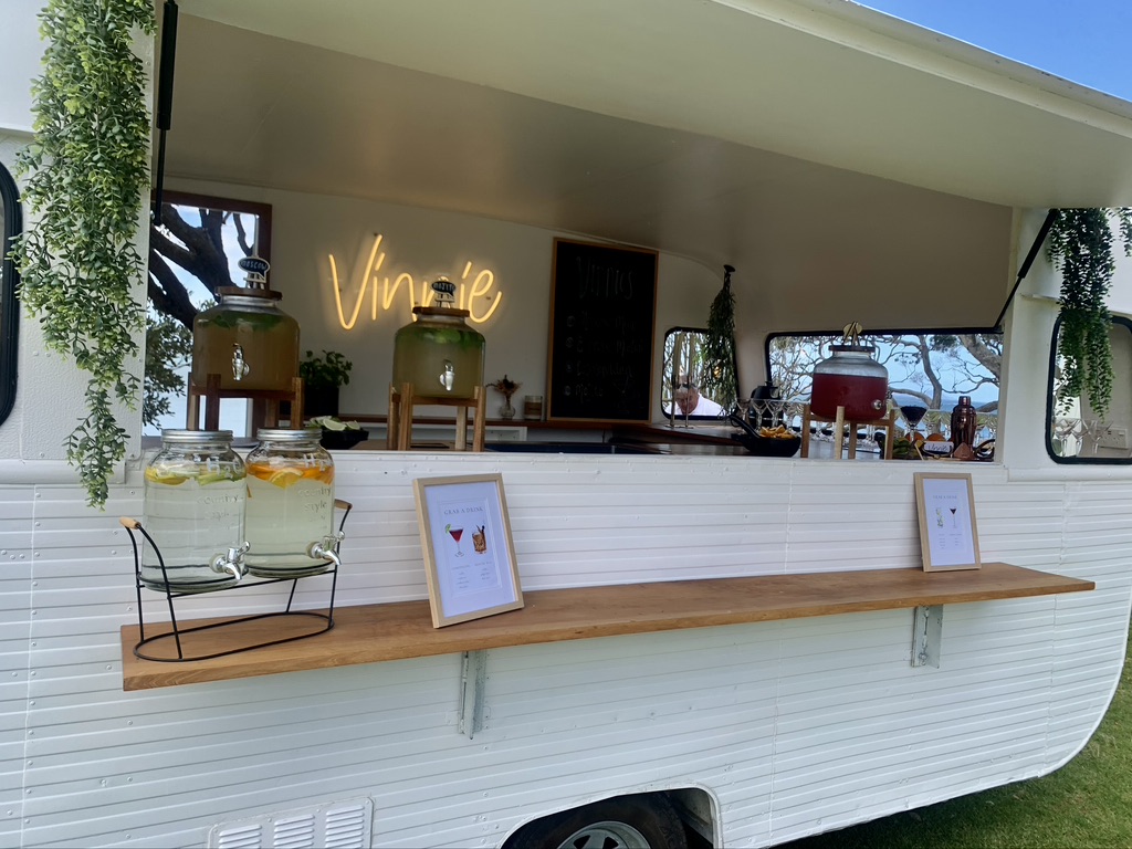 Infused water dispensers and menu cards along Vinnie's servery